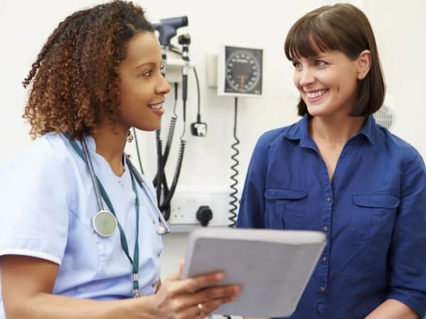 Healthcare professional consulting with patient